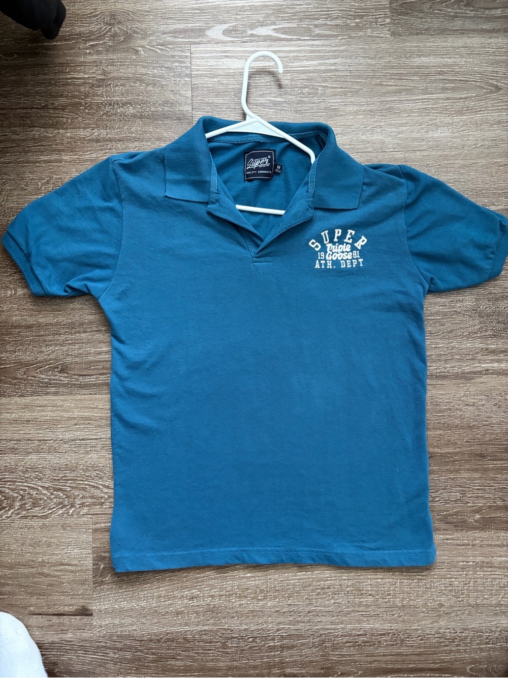 Vintage-style Super Triple Goose 81 polo shirt in a clean teal/blue colorway